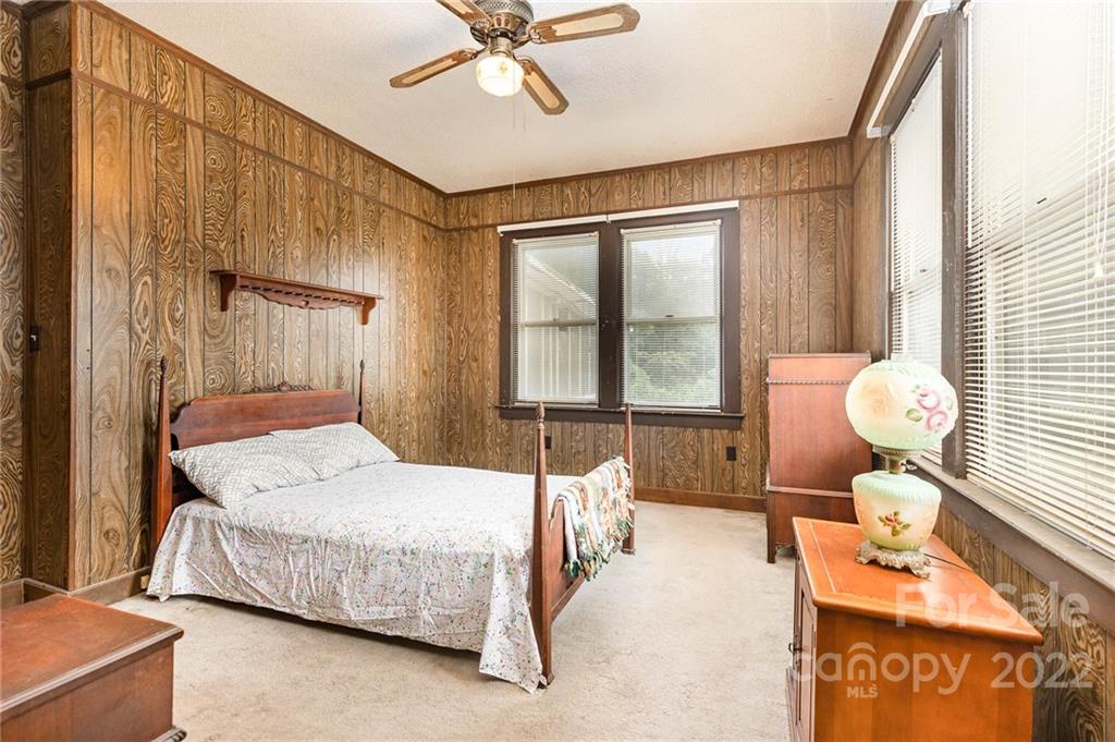 8209 Moores Chapel Road Charlotte, NC 28214 - Photo 19 of 32 a bedroom with a bed and a window