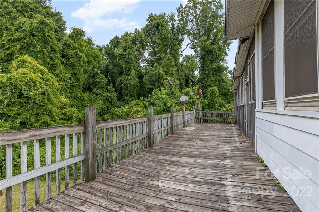 8209 Moores Chapel Road Charlotte, NC 28214 - Photo 26 of 32 a view of a balcony with wooden floor