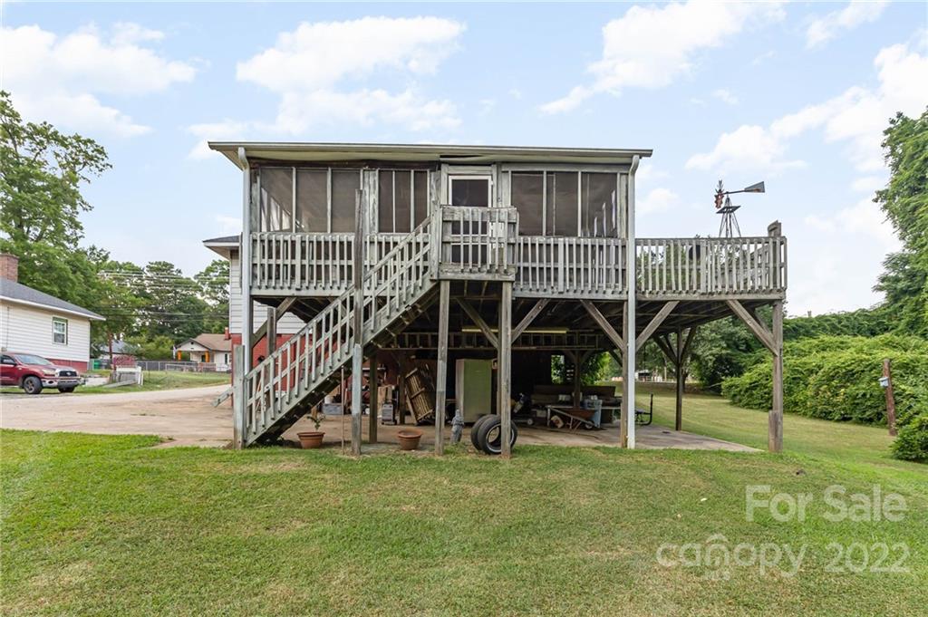8209 Moores Chapel Road Charlotte, NC 28214 - Photo 29 of 32 a view of a wooden deck and a big yard
