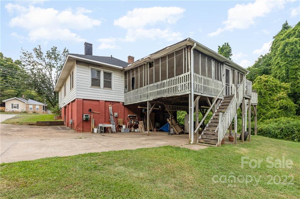 8209 Moores Chapel Road Charlotte, NC 28214 - Photo 30 of 32 a view of a house with a yard and a patio