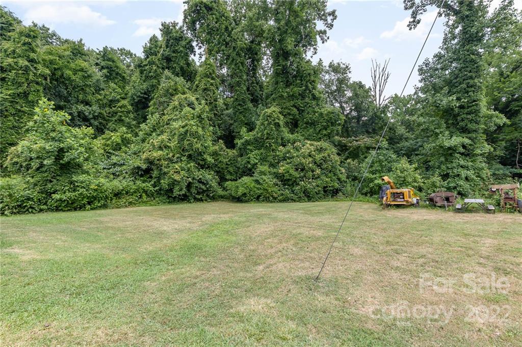 8209 Moores Chapel Road Charlotte, NC 28214 - Photo 31 of 32 a view of a yard with a tree