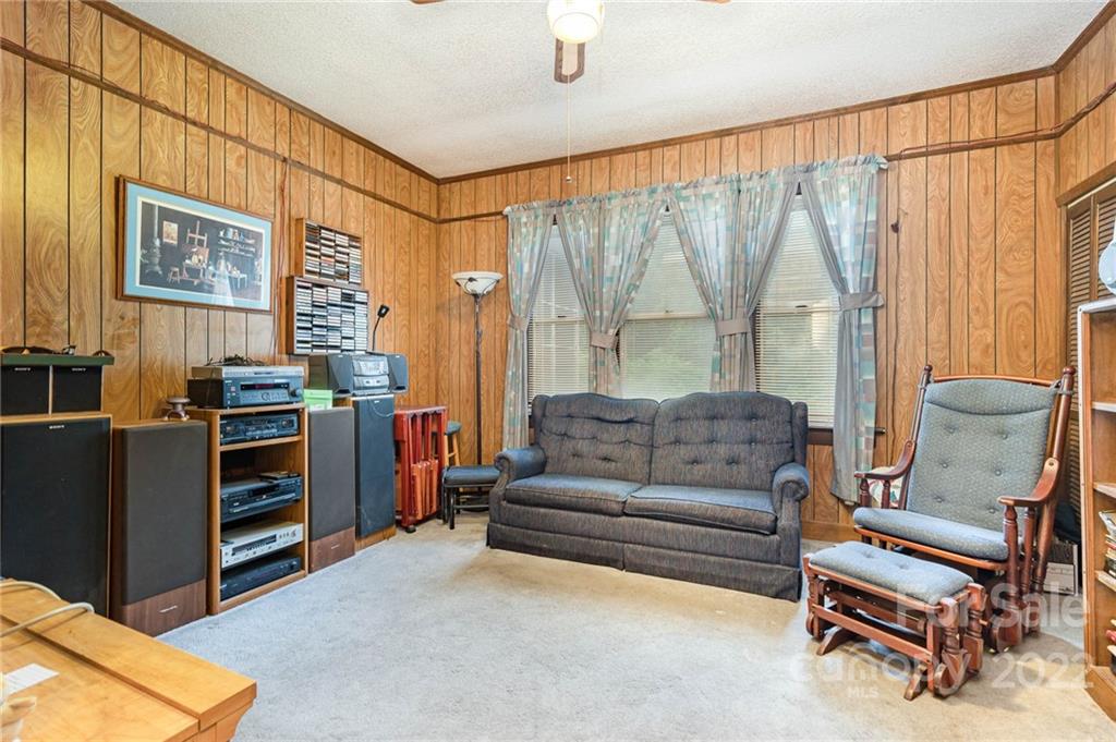 8209 Moores Chapel Road Charlotte, NC 28214 - Photo 4 of 32 a living room with furniture and a window