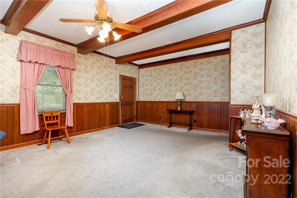 8209 Moores Chapel Road Charlotte, NC 28214 - Photo 10 of 32 an empty room with furniture and a window