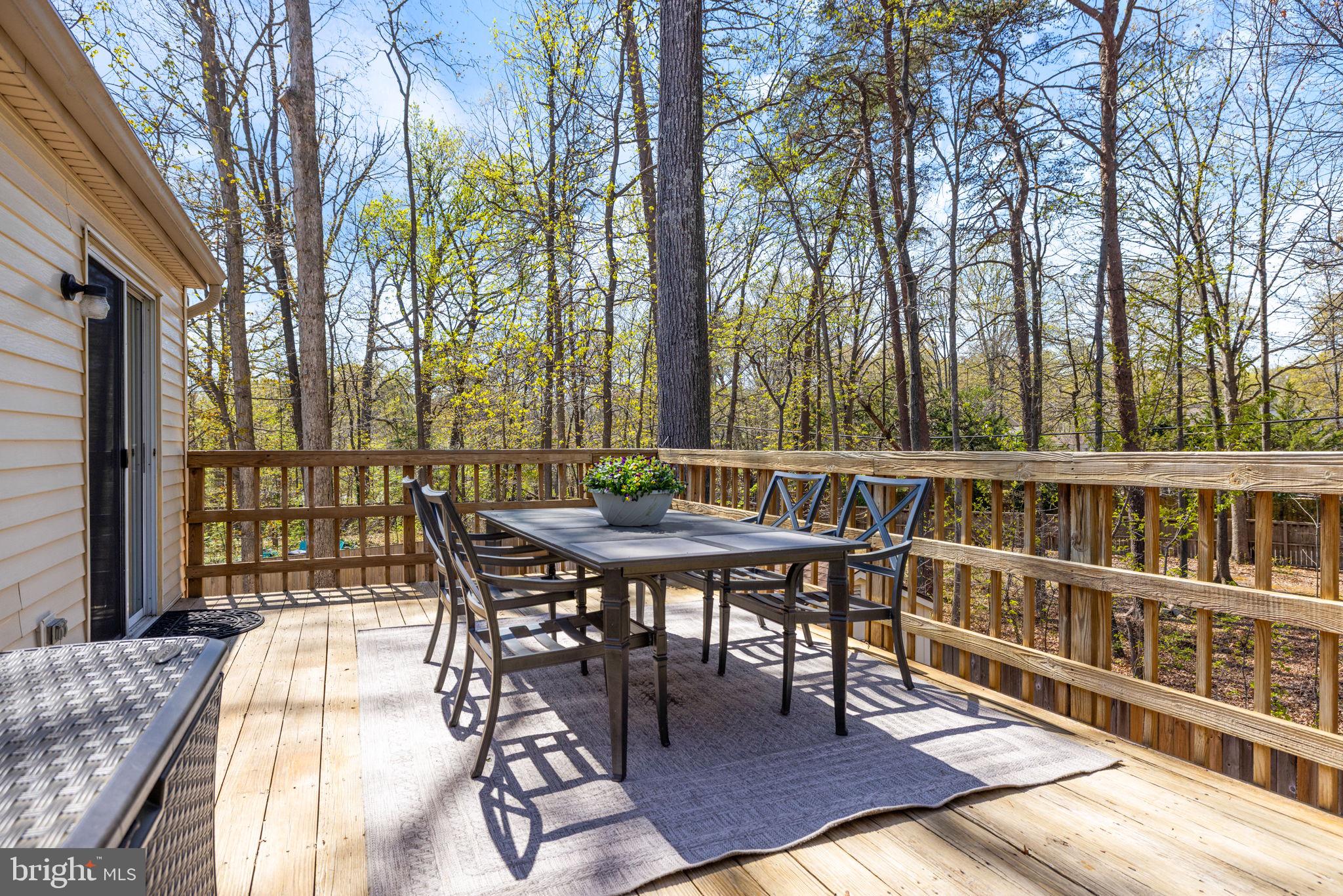12870 Graypine Place Herndon, VA 20170 - Photo 11 of 35 a view of a patio with a table chairs and a table