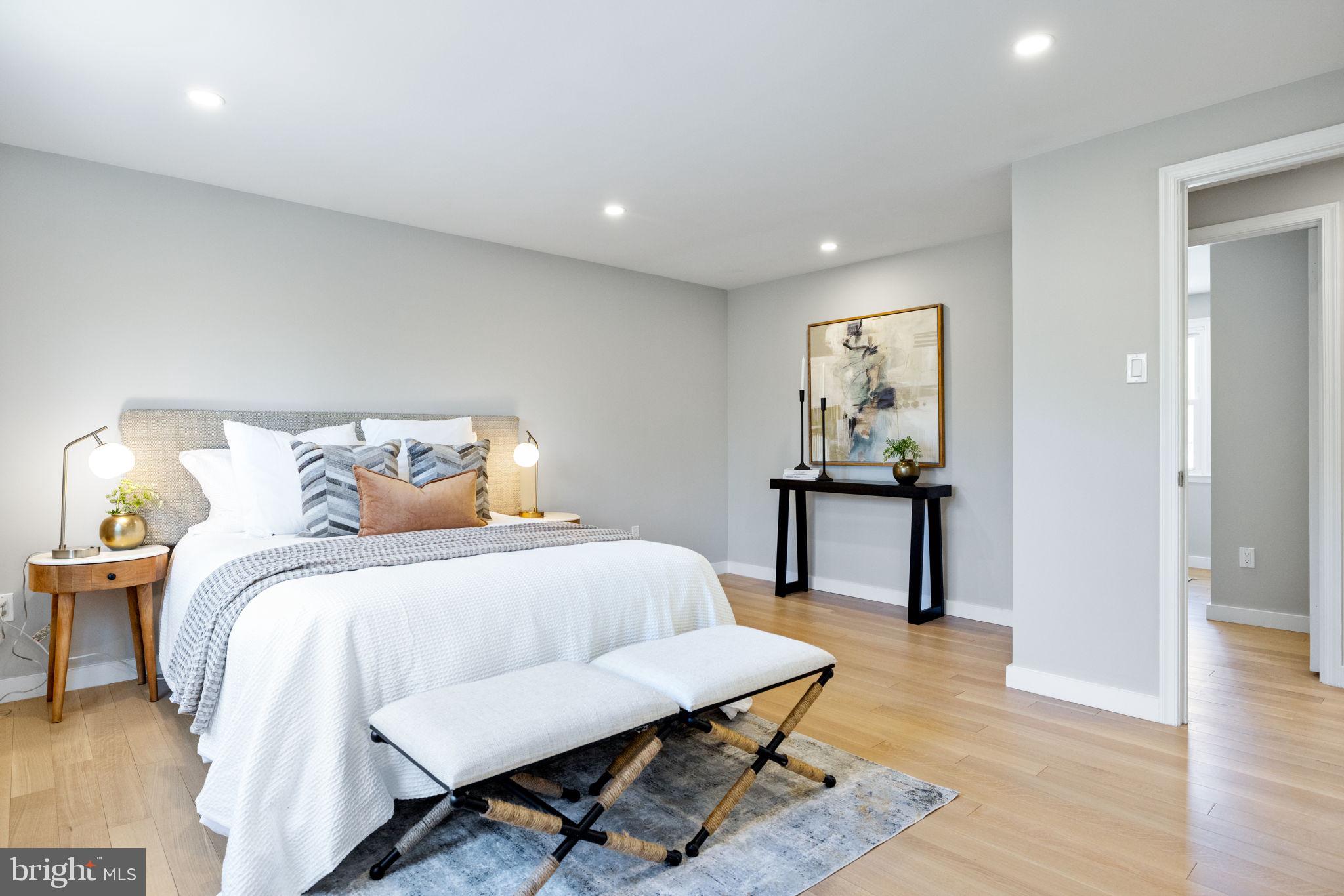 12870 Graypine Place Herndon, VA 20170 - Photo 12 of 35 a bedroom with a bed and a table