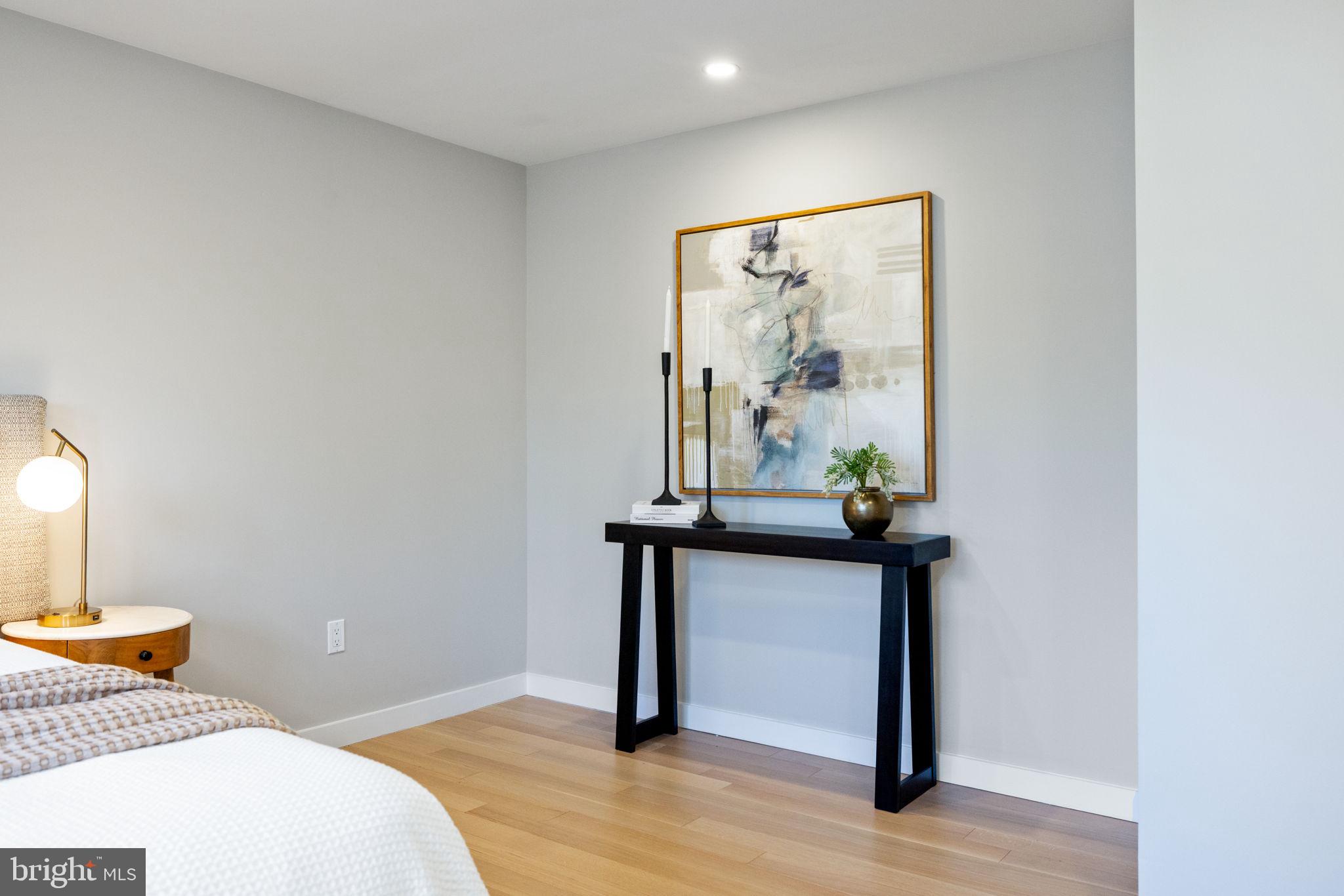 12870 Graypine Place Herndon, VA 20170 - Photo 14 of 35 a bedroom with a bed and a painting on the wall