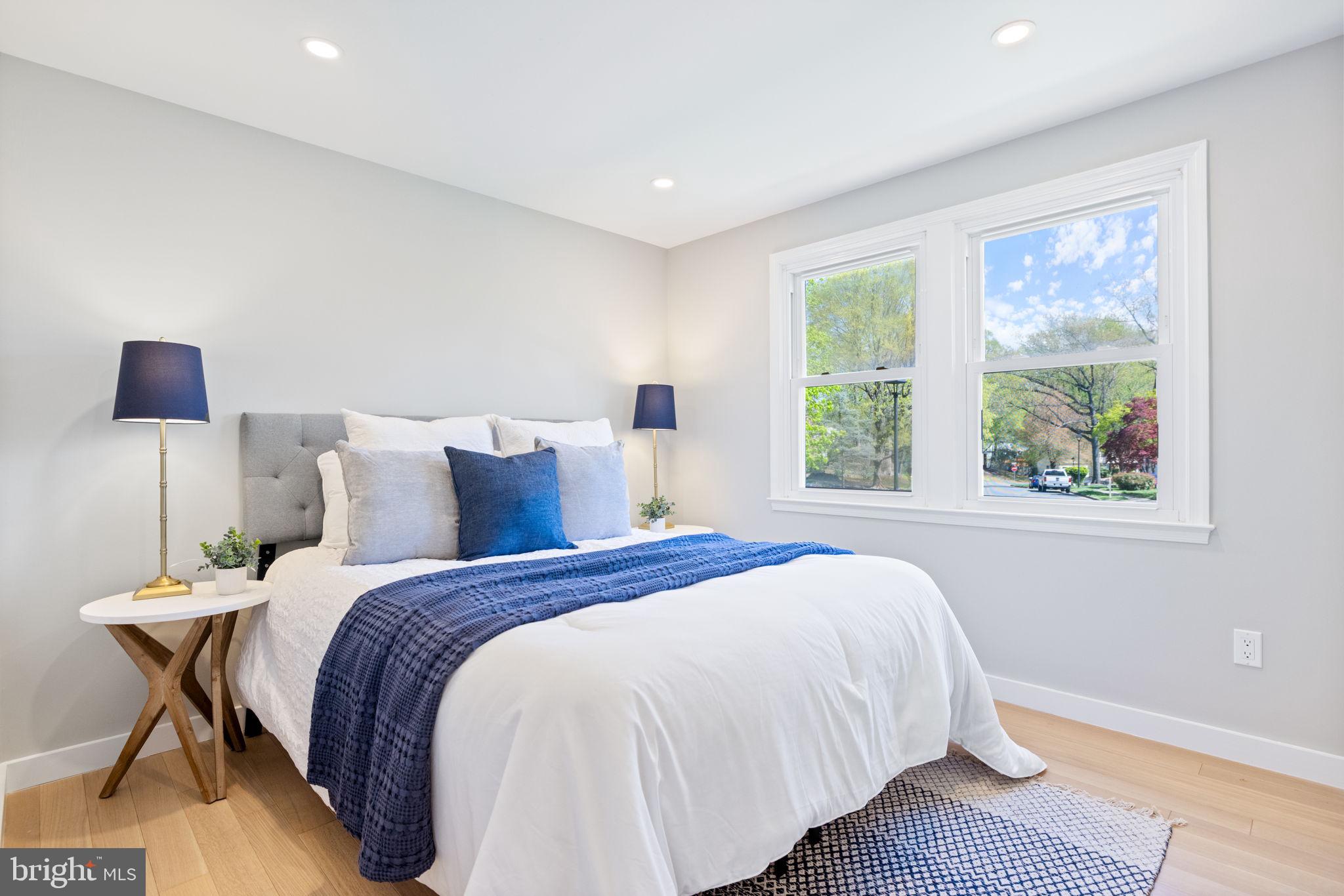 12870 Graypine Place Herndon, VA 20170 - Photo 16 of 35 a bedroom with bed and a night stand