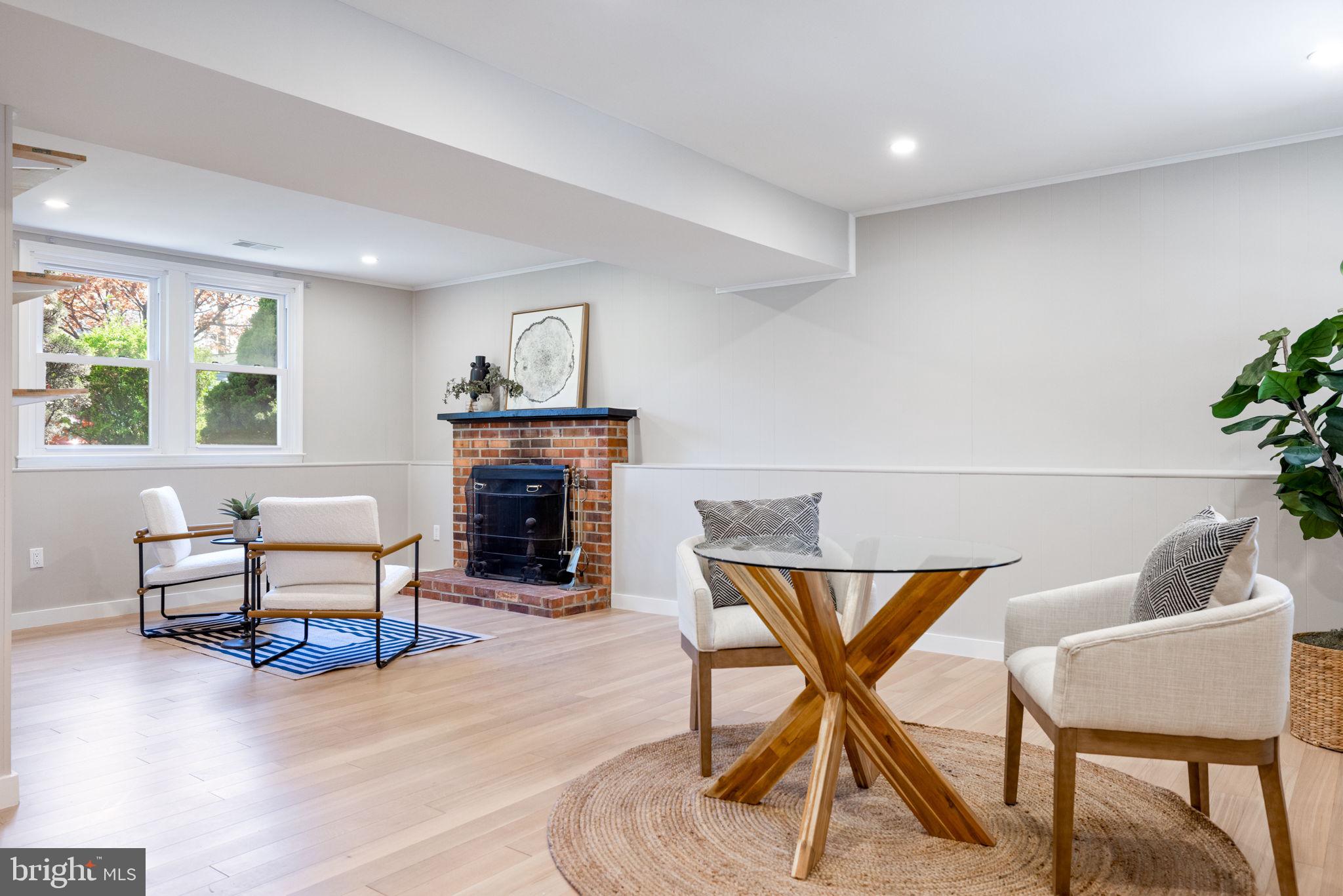 12870 Graypine Place Herndon, VA 20170 - Photo 20 of 35 a living room with furniture and a fireplace