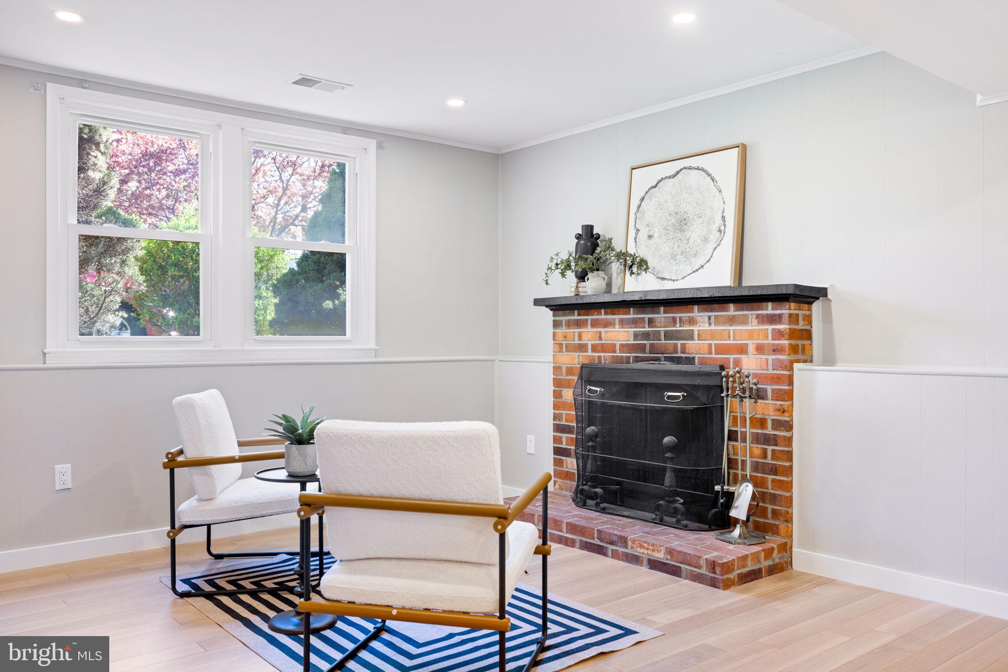 12870 Graypine Place Herndon, VA 20170 - Photo 23 of 35 a living room with furniture a window and a fireplace