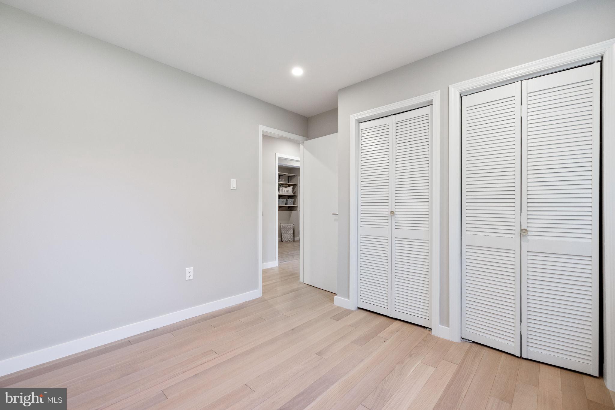 12870 Graypine Place Herndon, VA 20170 - Photo 28 of 35 an empty room with wooden floor & windows