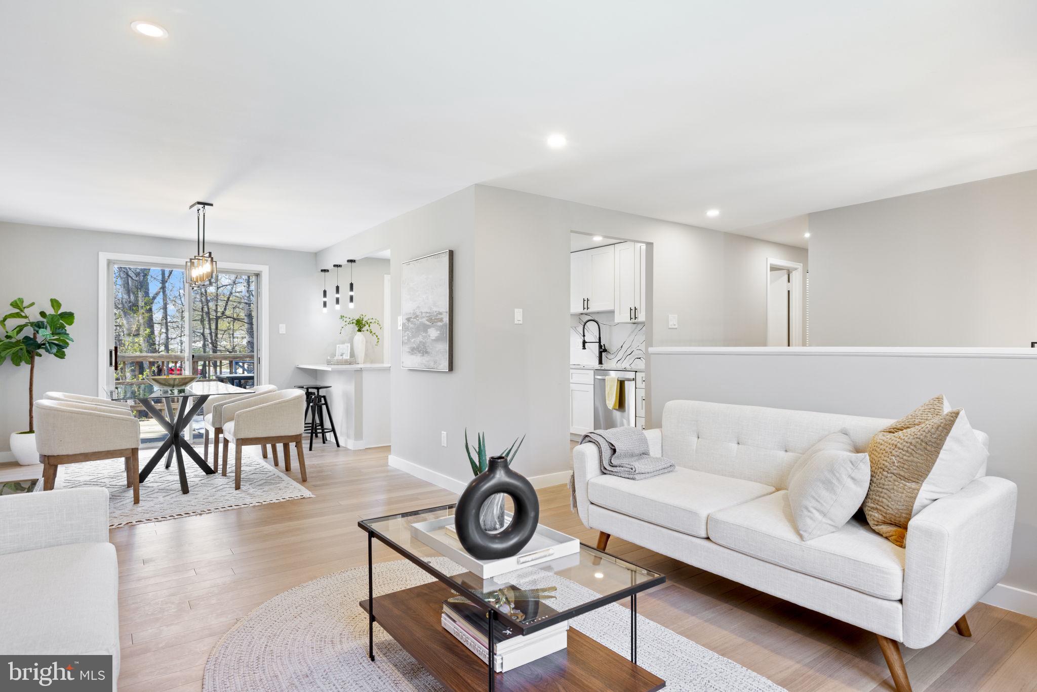 12870 Graypine Place Herndon, VA 20170 - Photo 3 of 35 a living room with furniture and a wooden floor