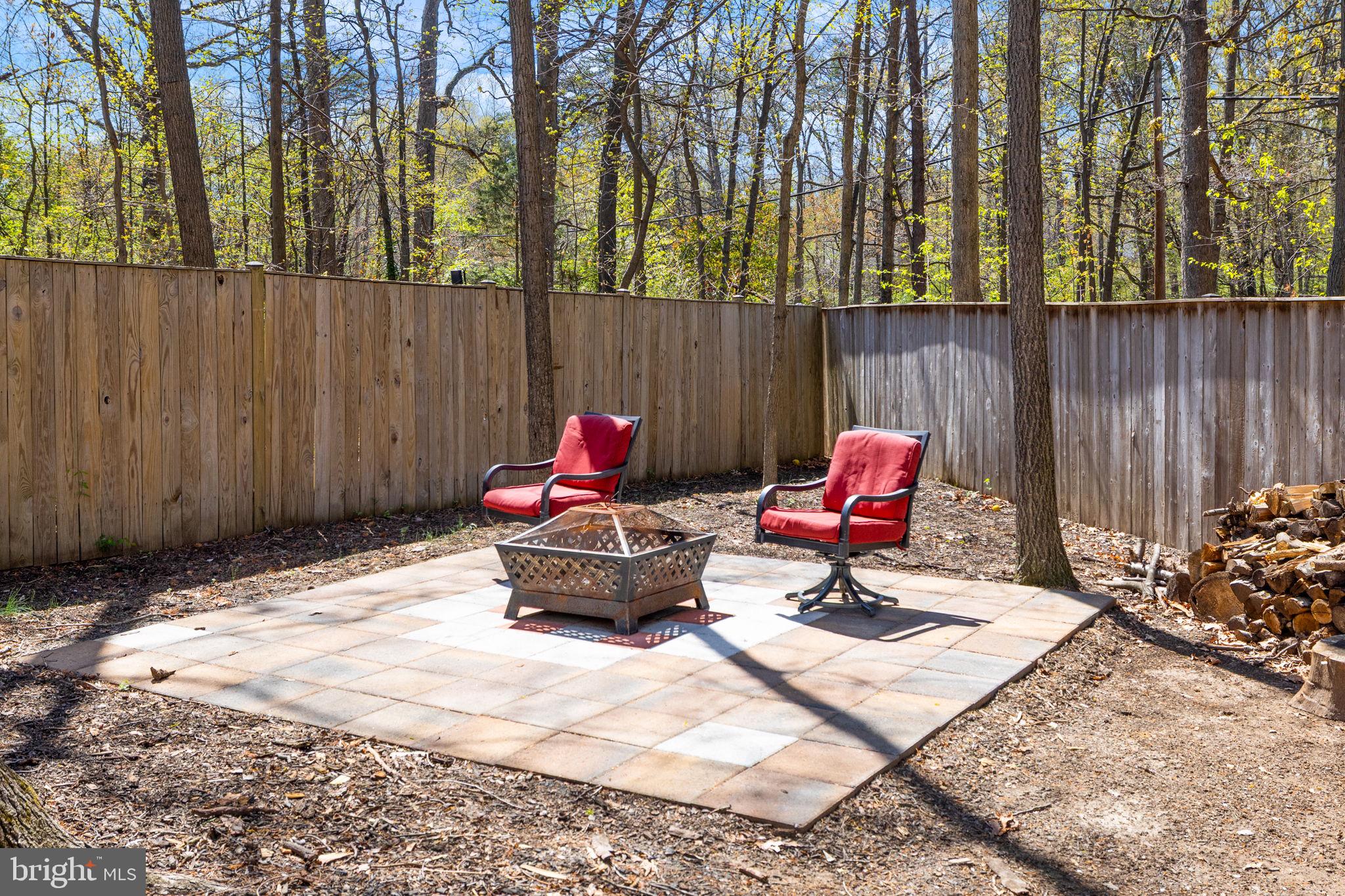 12870 Graypine Place Herndon, VA 20170 - Photo 33 of 35 a bench is sitting in the middle of a backyard