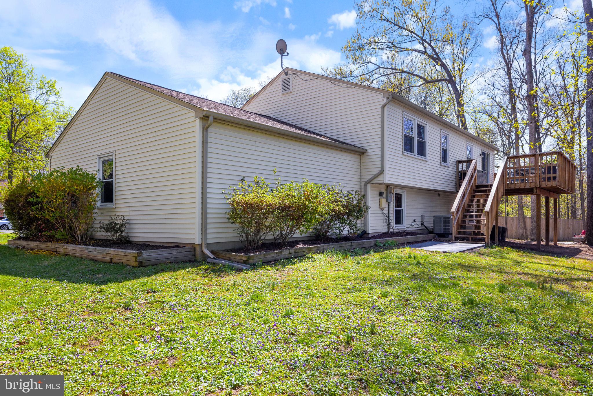 12870 Graypine Place Herndon, VA 20170 - Photo 34 of 35 a view of a house with a yard and plants