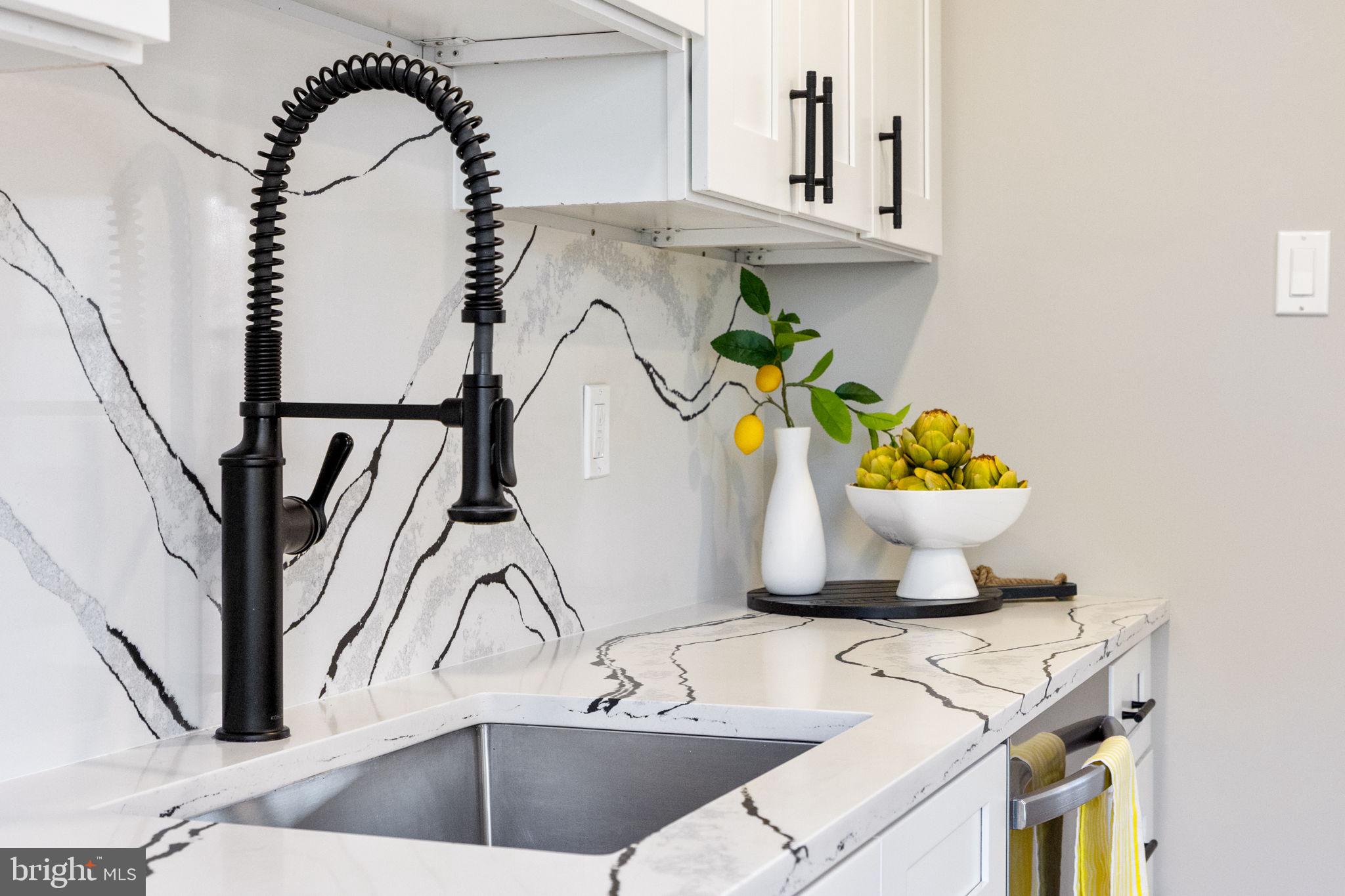 12870 Graypine Place Herndon, VA 20170 - Photo 7 of 35 a bathroom with a sink a vanity and a window