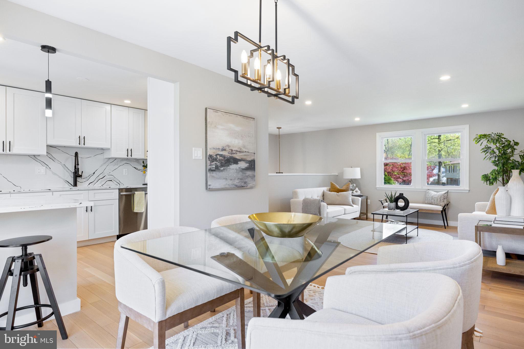 12870 Graypine Place Herndon, VA 20170 - Photo 9 of 35 a living room with furniture kitchen view and a chandelier