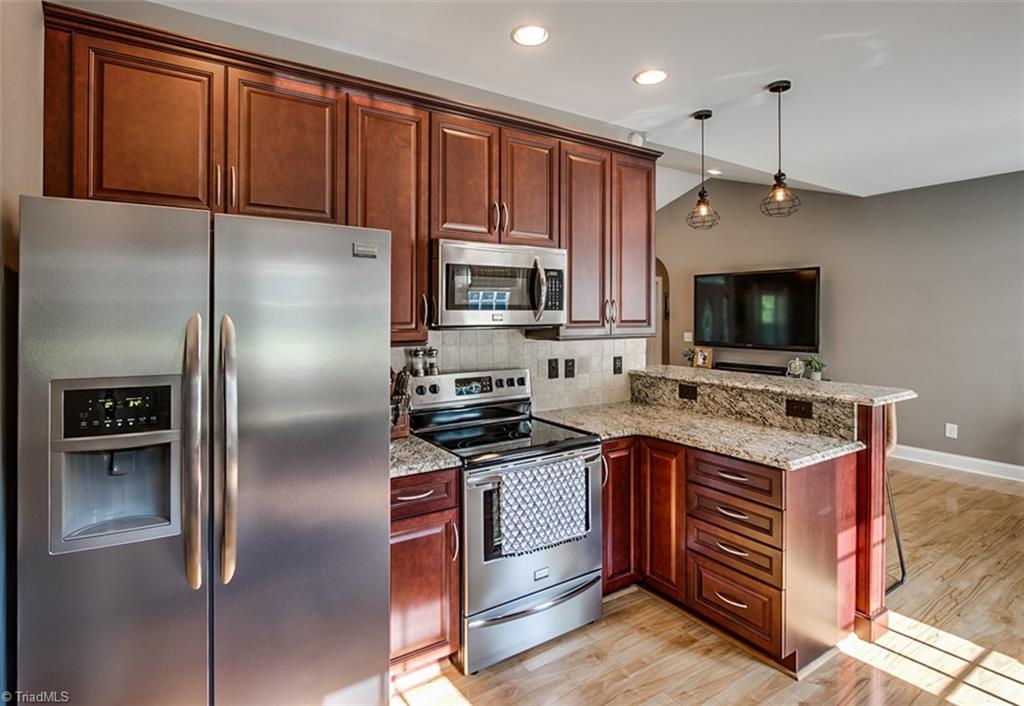 6388 Branson Davis Road Randleman, NC 27317 - Photo 11 of 30 Kitchen, stainless appliances include stove/range, microwave & dishwasher
