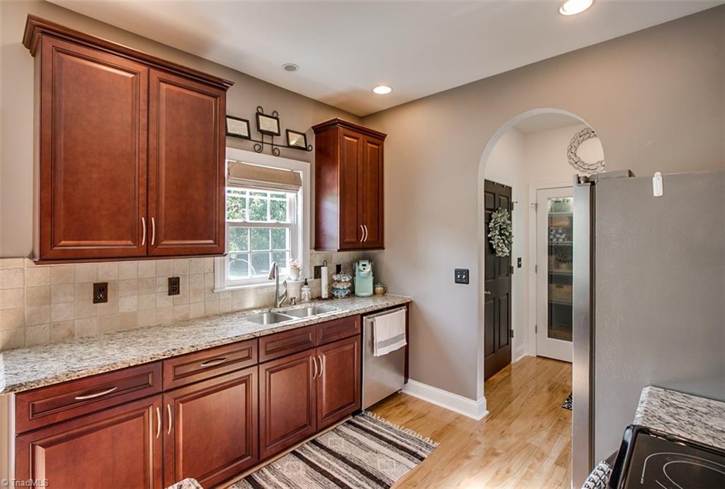 6388 Branson Davis Road Randleman, NC 27317 - Photo 9 of 30 Kitchen with granite counters & under cabinet lighting