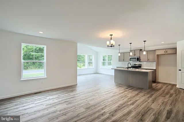 a view of kitchen and kitchen with wooden floor