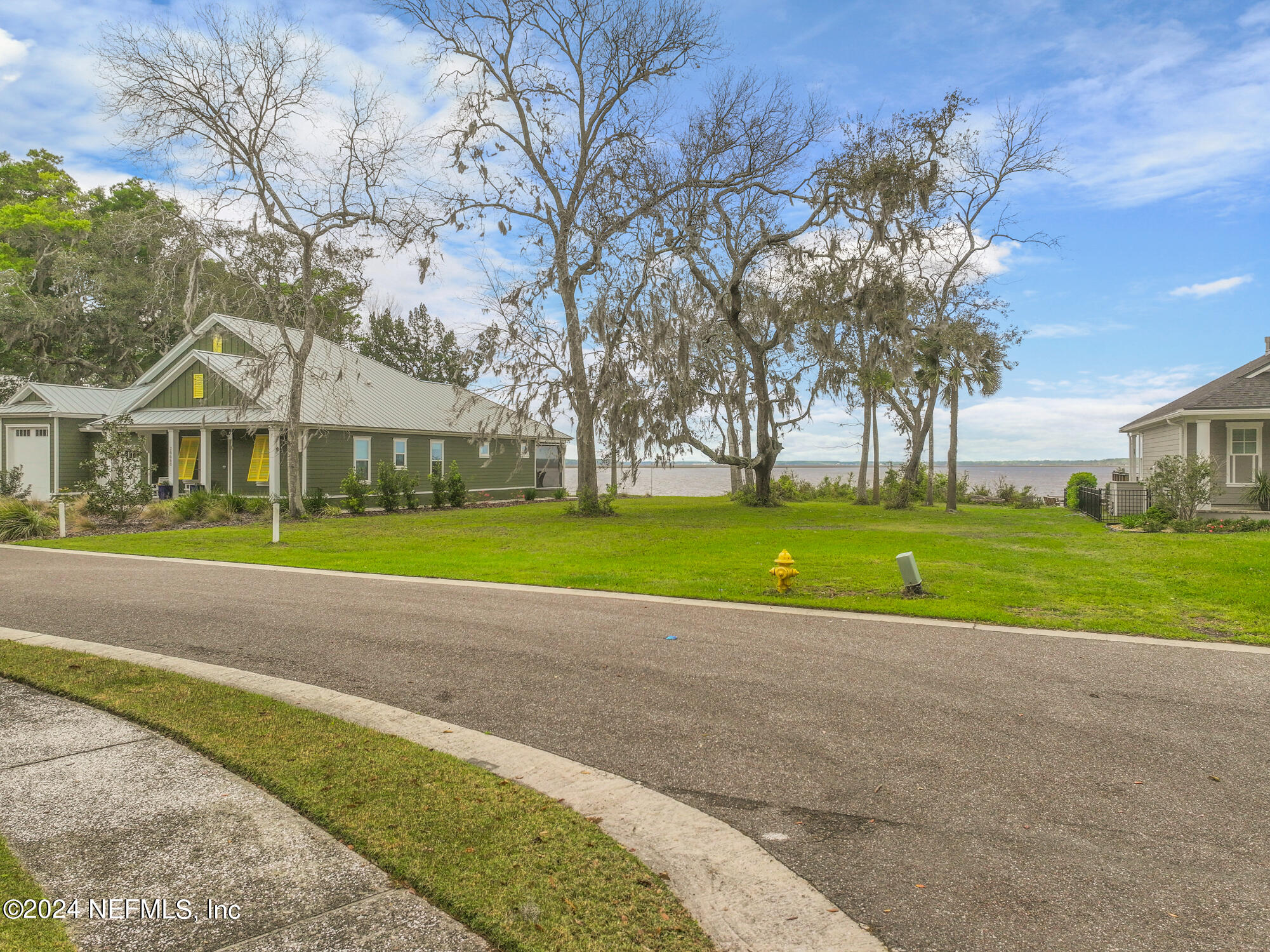 28676 Grandview Manor Yulee, FL 32097 - Photo 5 of 23 a view of a house with a big yard and large trees