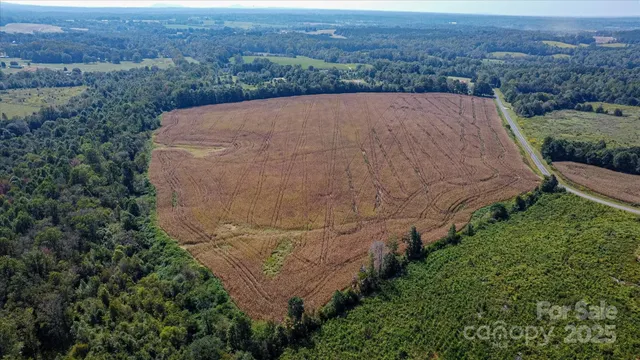 a aerial view of a house with a yard