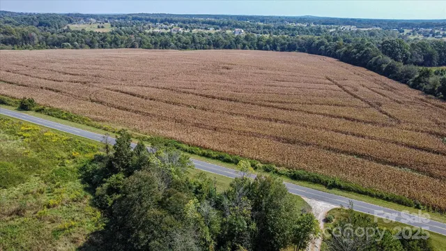 a view of a swimming pool with a yard