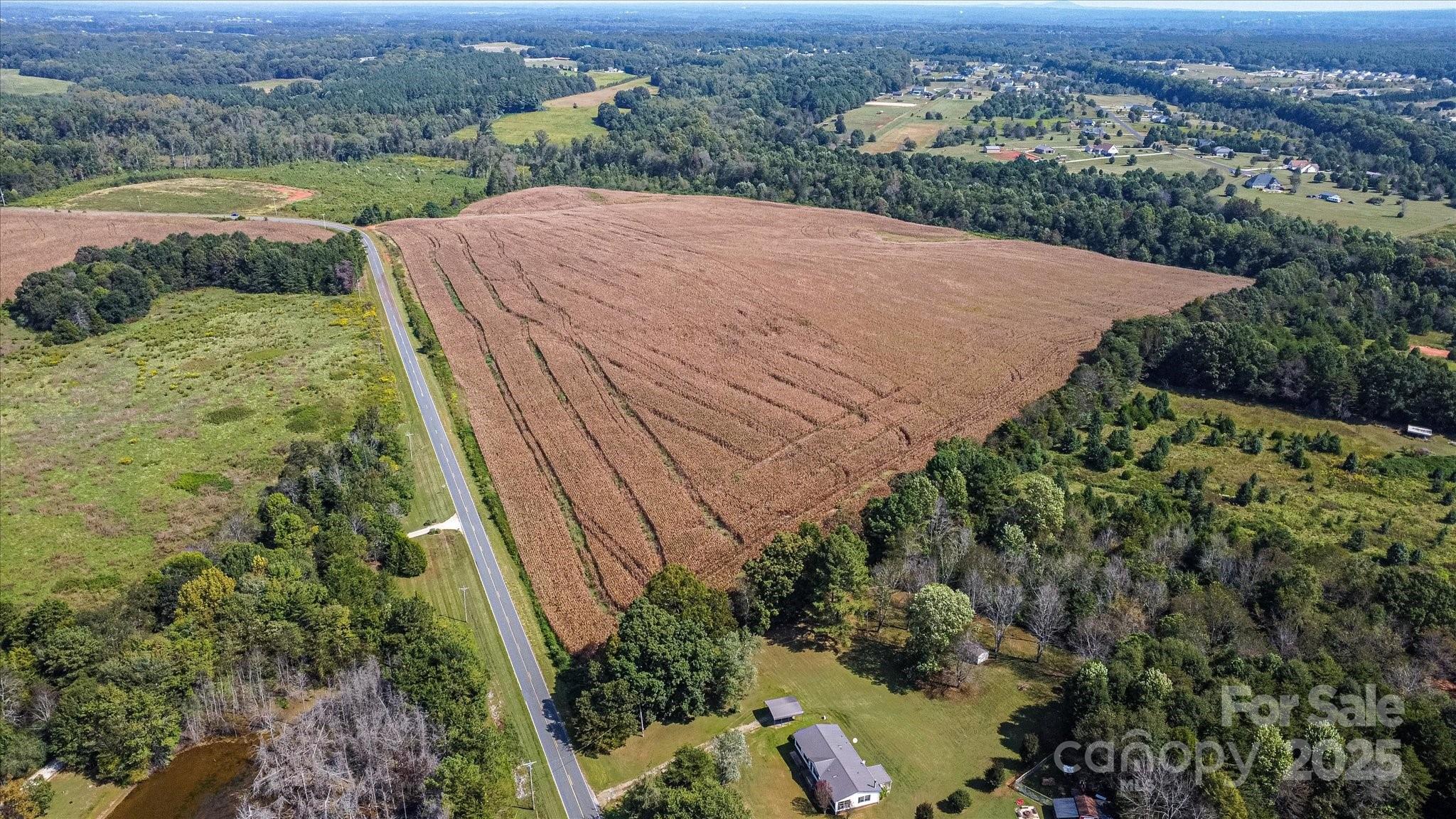 0 Leonards Fork Church Road Crouse, NC 28033 - Photo 4 of 17 an aerial view of a house with a yard and lake view