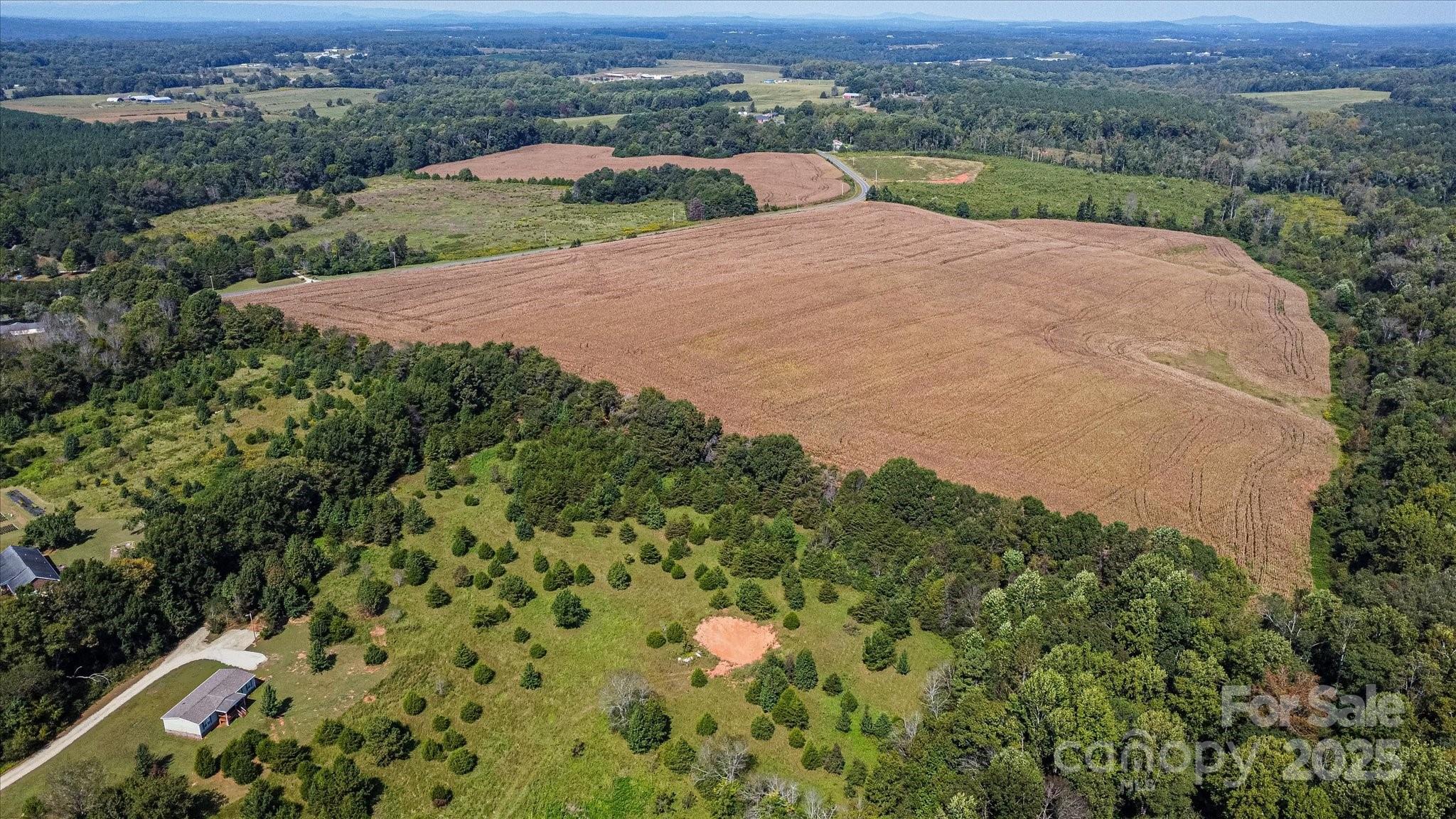 0 Leonards Fork Church Road Crouse, NC 28033 - Photo 7 of 17 an aerial view of a house with a yard and lake view