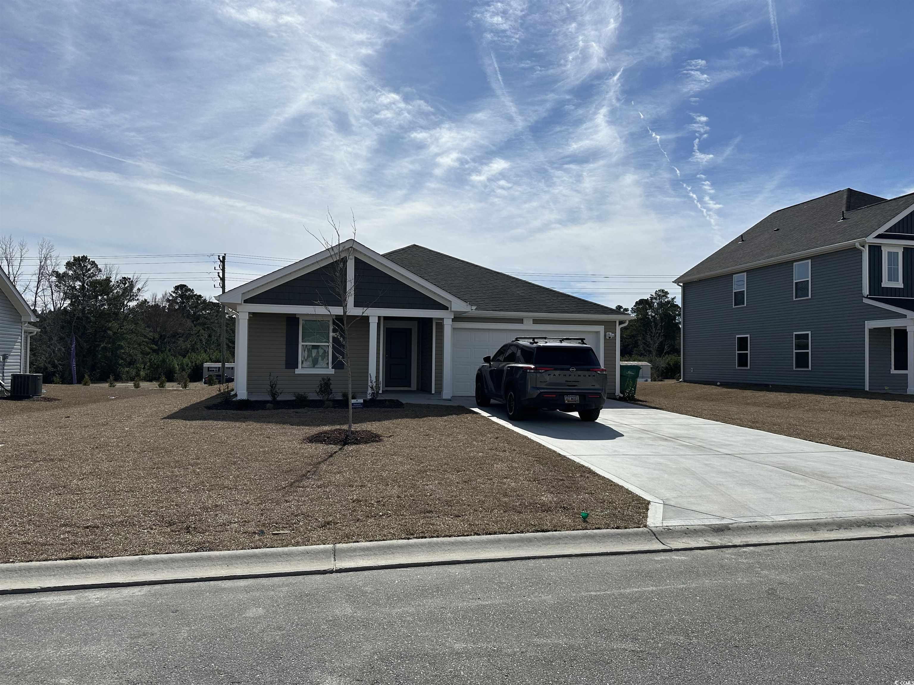 72 Cpe Pt Drive Conway, SC 29527 - Photo 1 of 34 View of front facade with a garage and central AC
