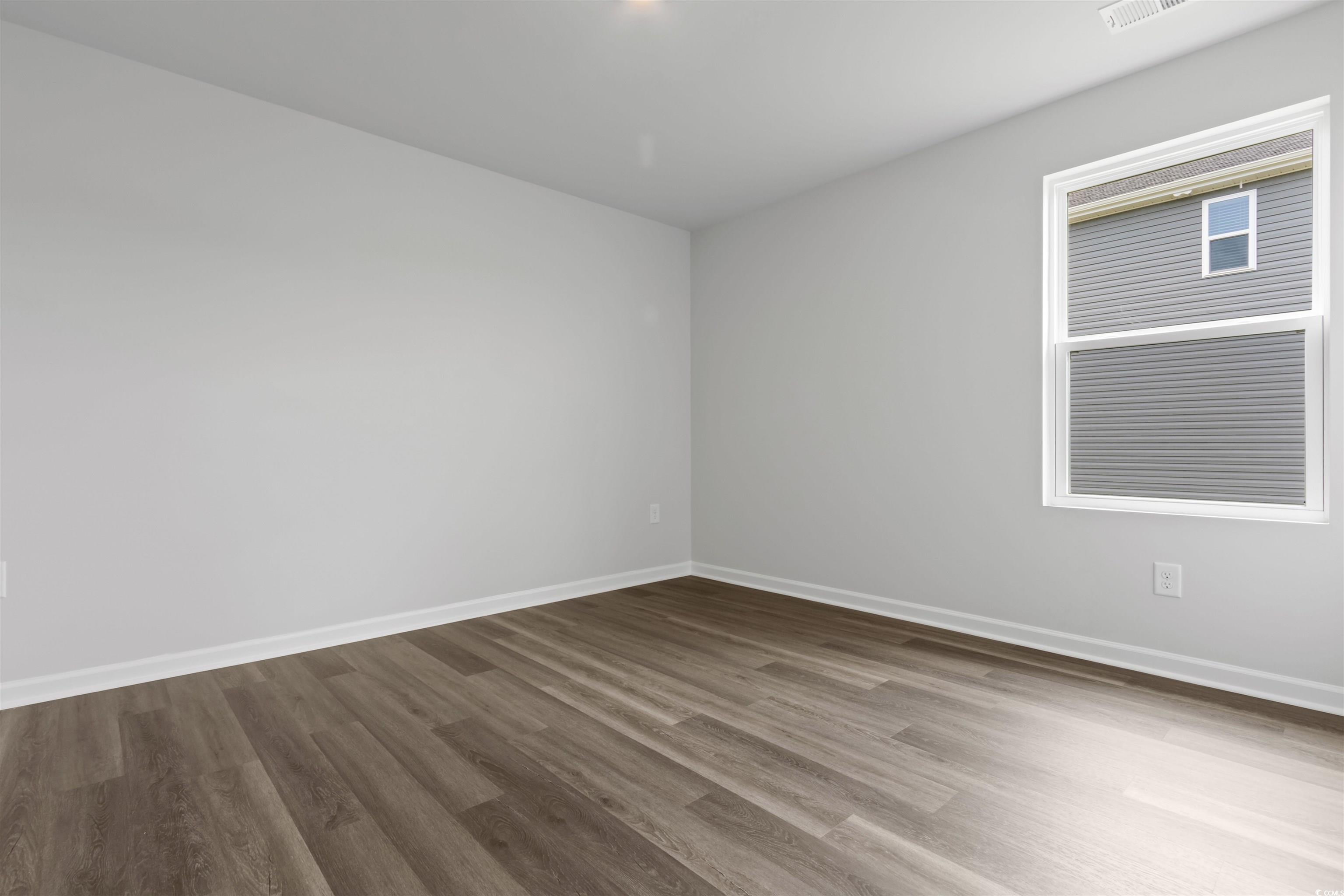 72 Cpe Pt Drive Conway, SC 29527 - Photo 12 of 34 Empty room featuring hardwood / wood-style floorin