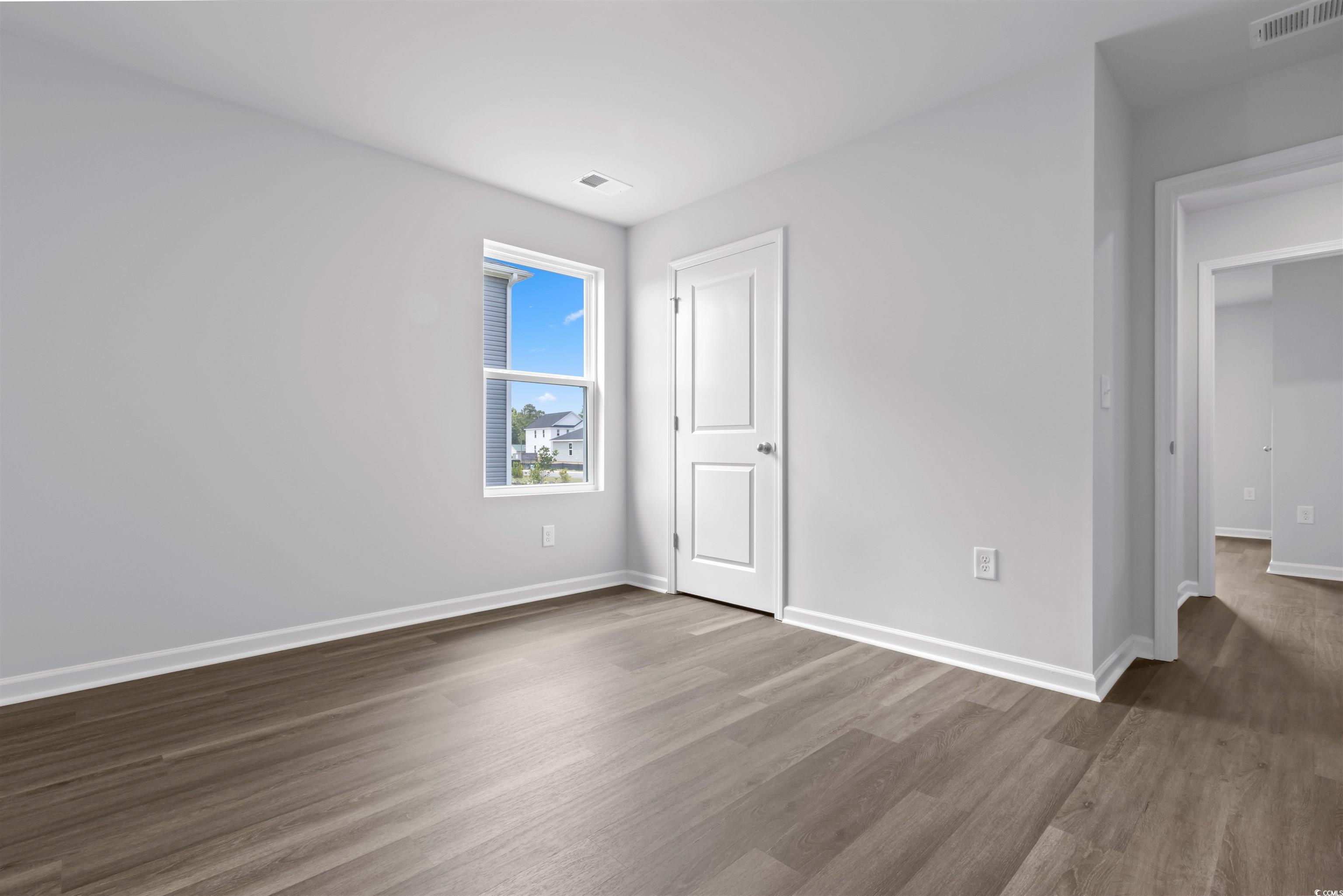 72 Cpe Pt Drive Conway, SC 29527 - Photo 13 of 34 Unfurnished bedroom with dark wood-type flooring