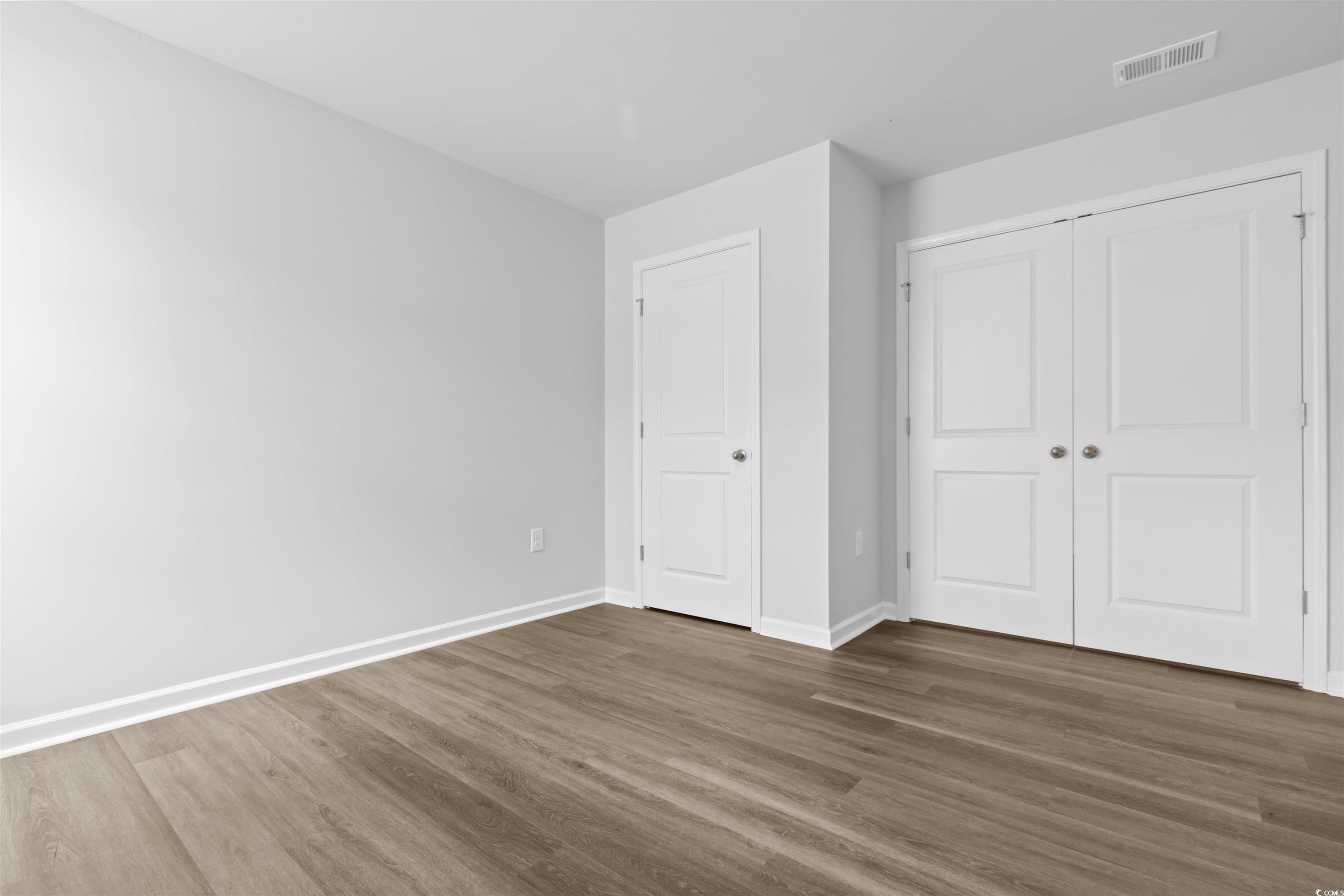 72 Cpe Pt Drive Conway, SC 29527 - Photo 16 of 34 Unfurnished bedroom with dark wood-type flooring a