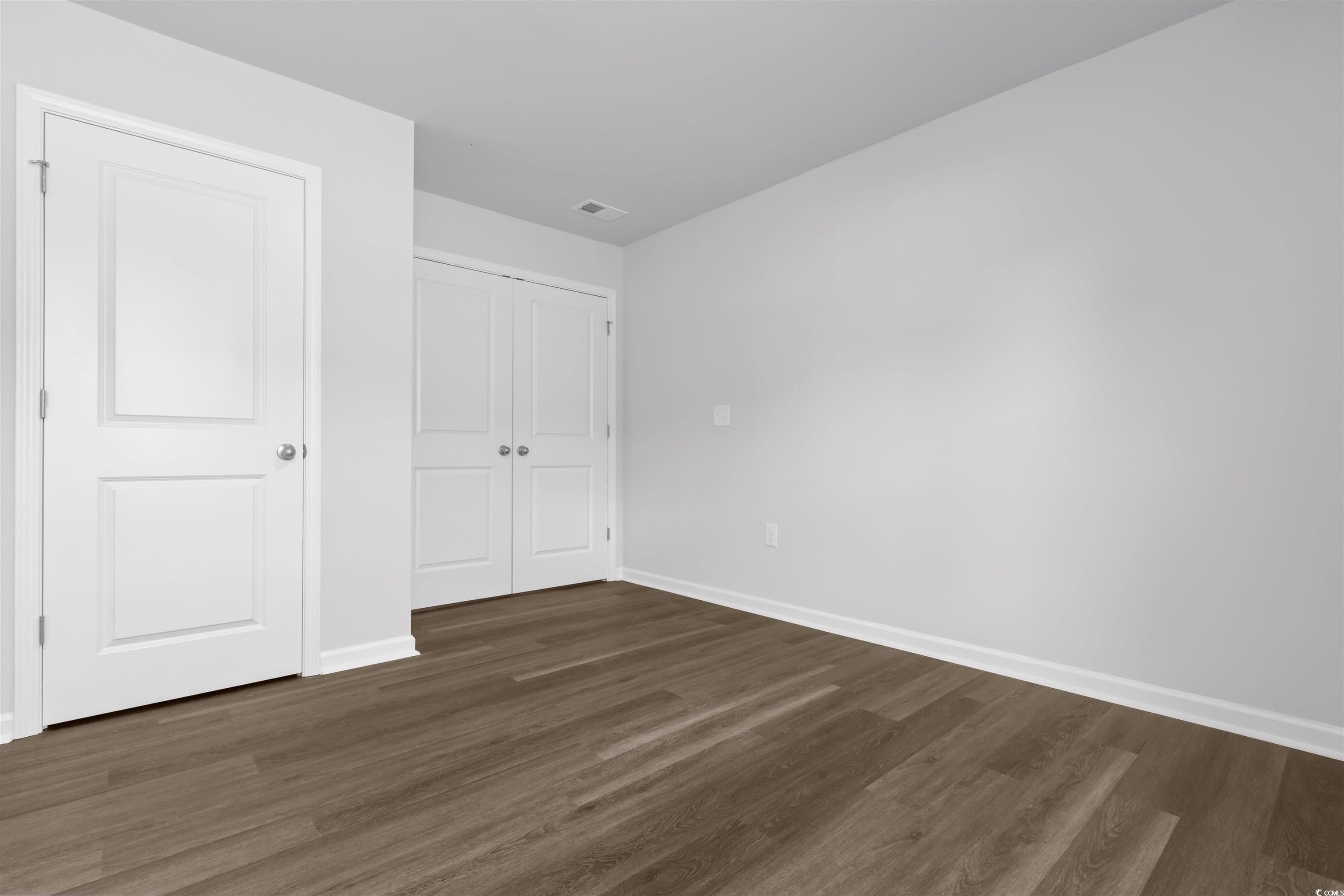 72 Cpe Pt Drive Conway, SC 29527 - Photo 17 of 34 Unfurnished bedroom with a closet and dark wood-ty