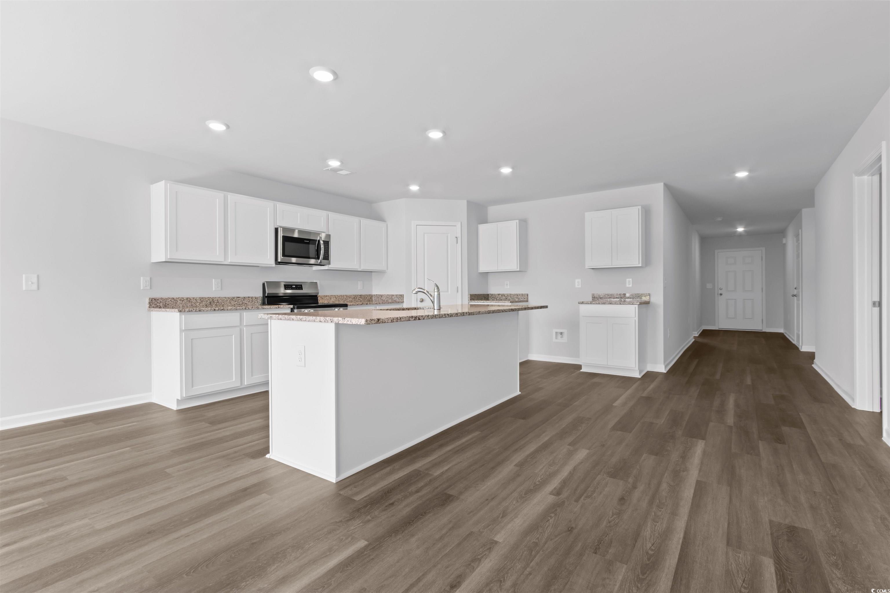 72 Cpe Pt Drive Conway, SC 29527 - Photo 20 of 34 Kitchen with light stone counters, white cabinets,