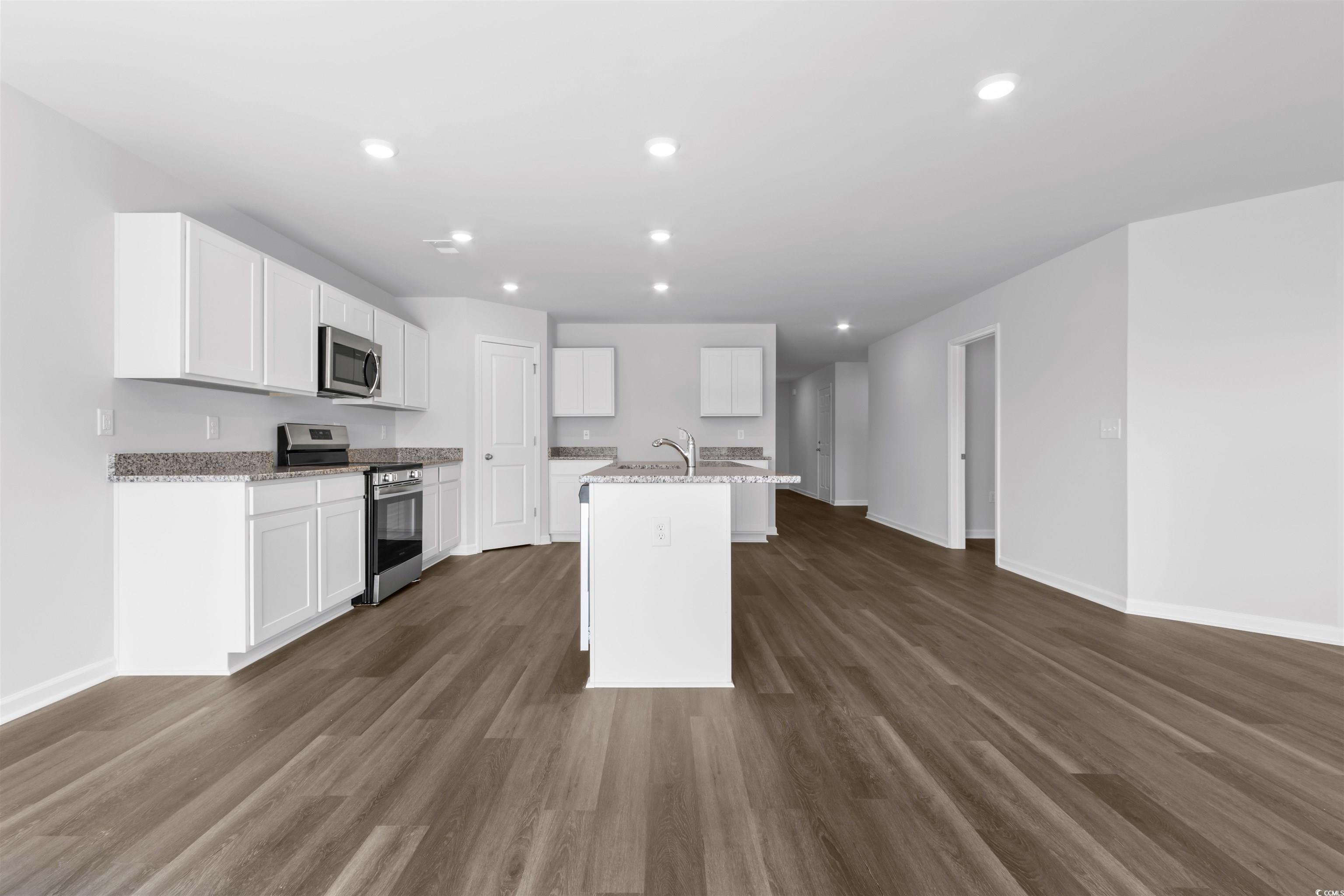 72 Cpe Pt Drive Conway, SC 29527 - Photo 21 of 34 Kitchen featuring white cabinets, a kitchen island