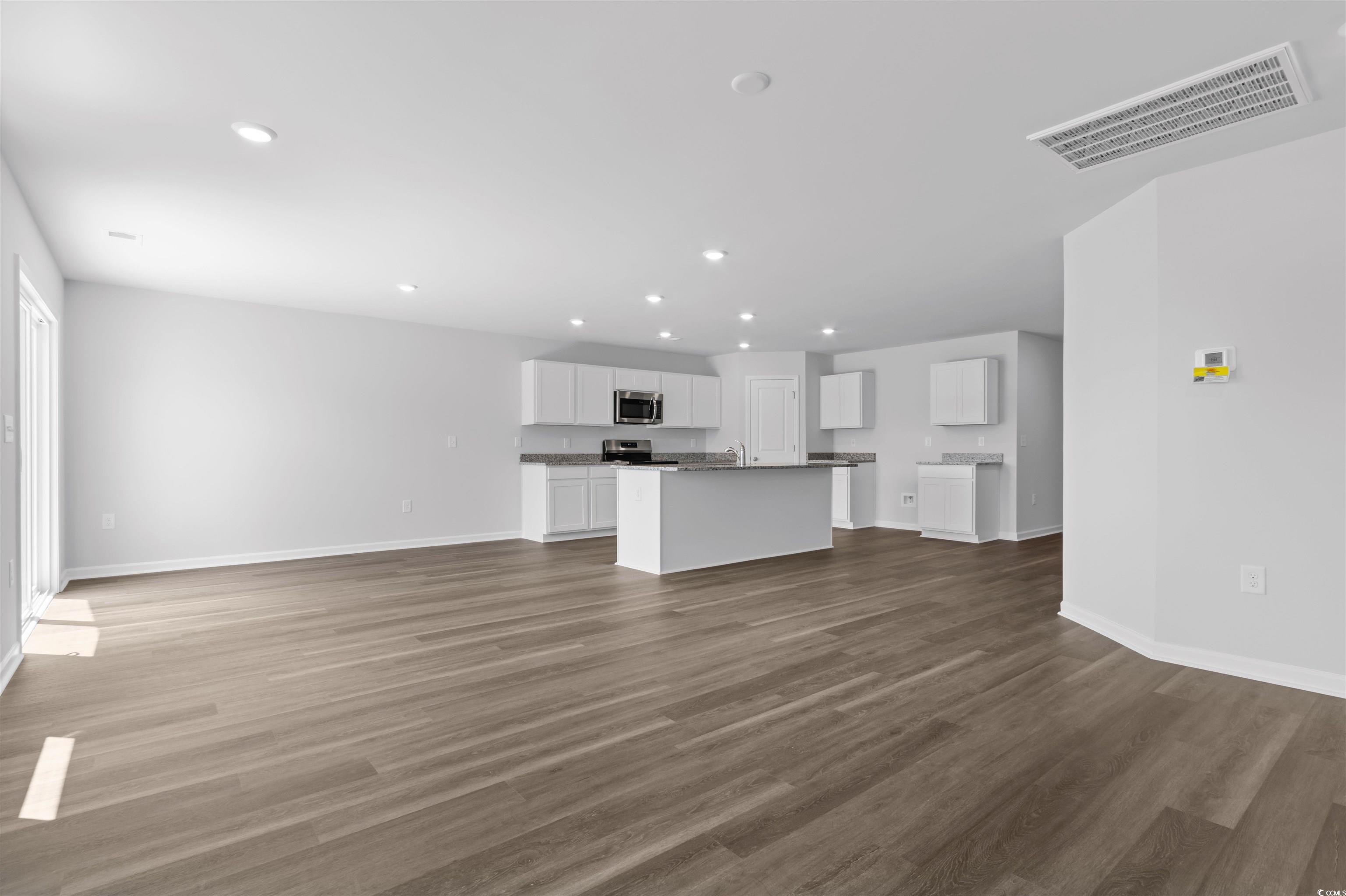 72 Cpe Pt Drive Conway, SC 29527 - Photo 27 of 34 Unfurnished living room featuring dark hardwood /
