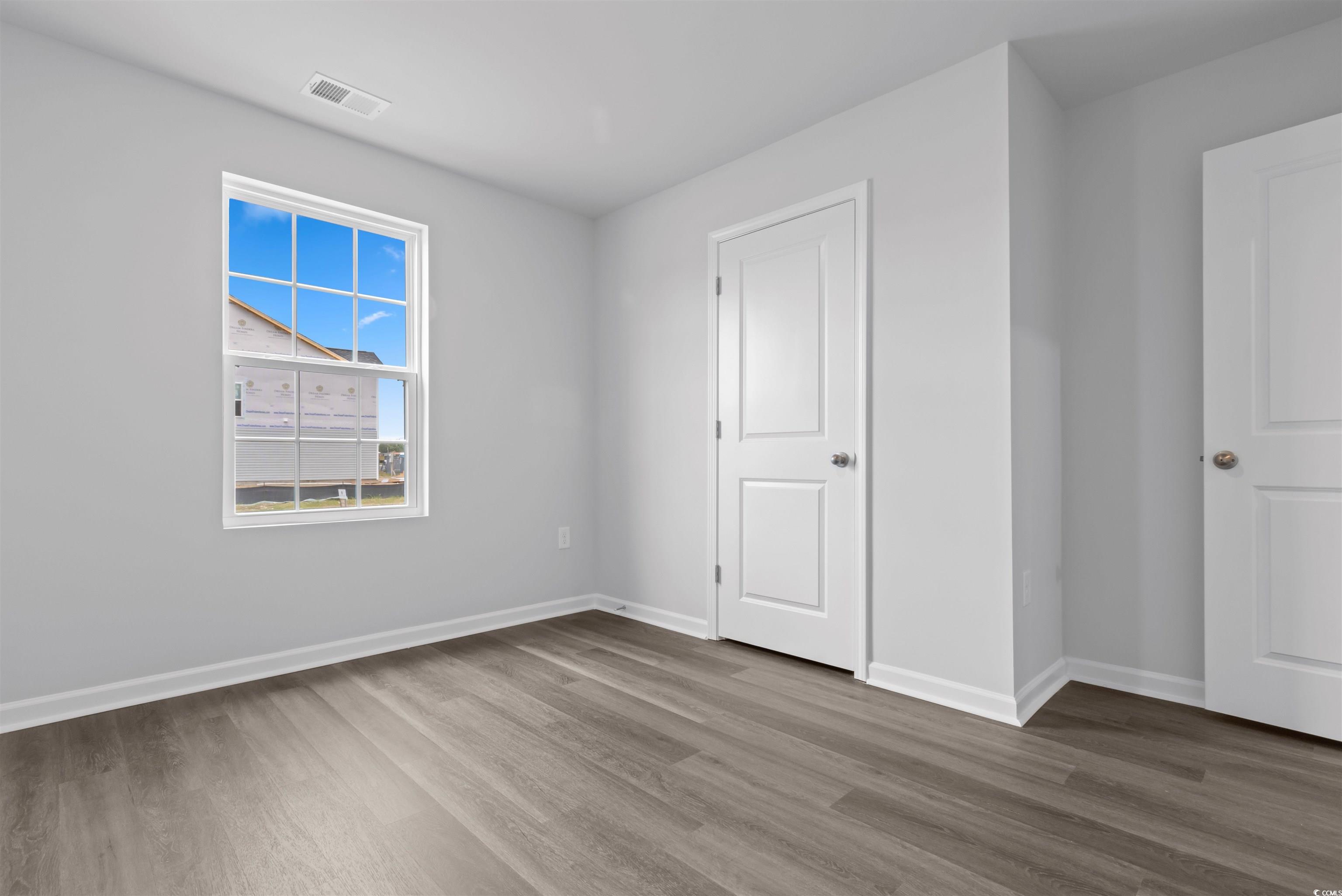72 Cpe Pt Drive Conway, SC 29527 - Photo 8 of 34 Unfurnished bedroom with hardwood / wood-style flo
