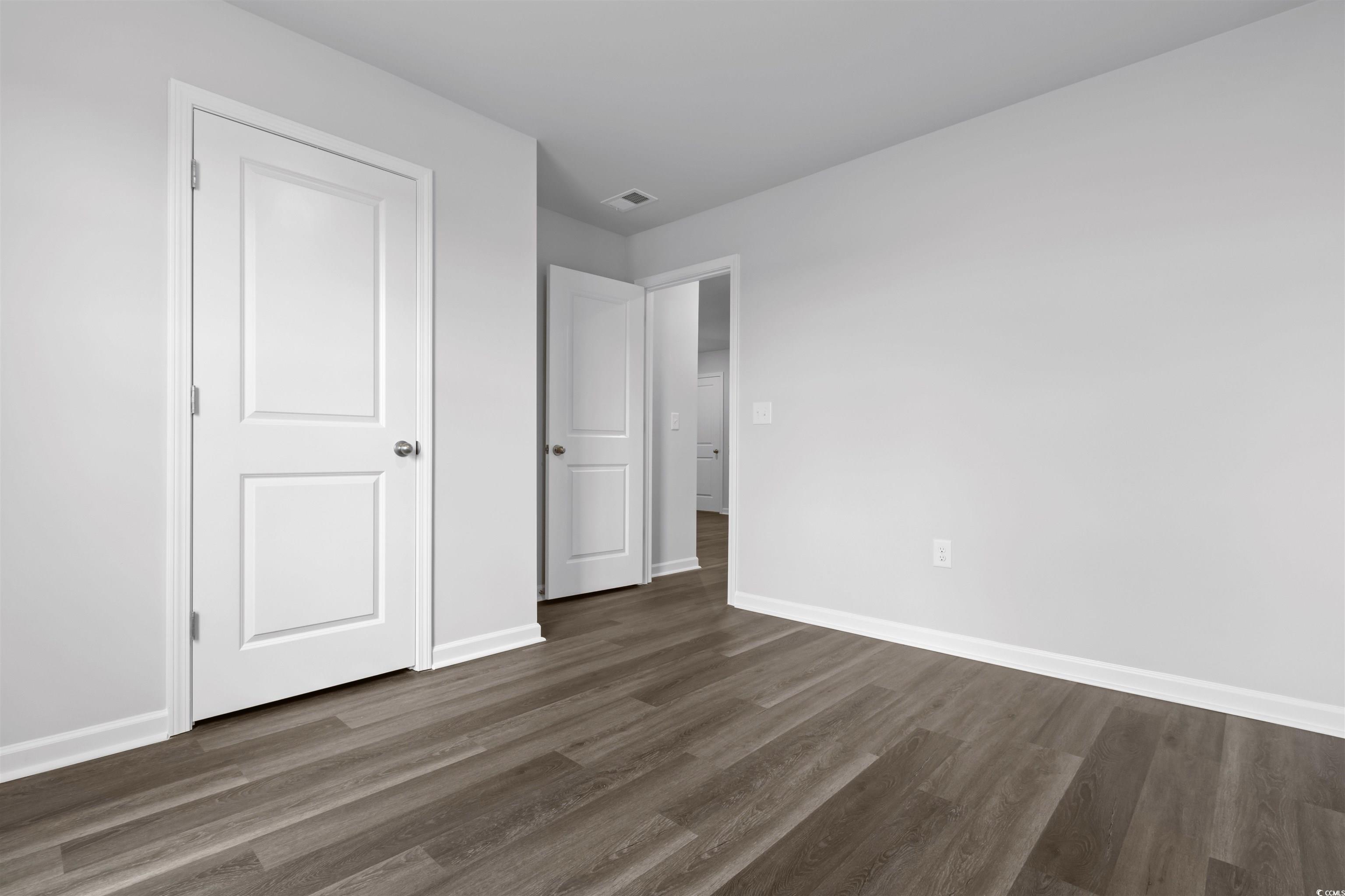 72 Cpe Pt Drive Conway, SC 29527 - Photo 10 of 34 Unfurnished bedroom with dark wood-type flooring