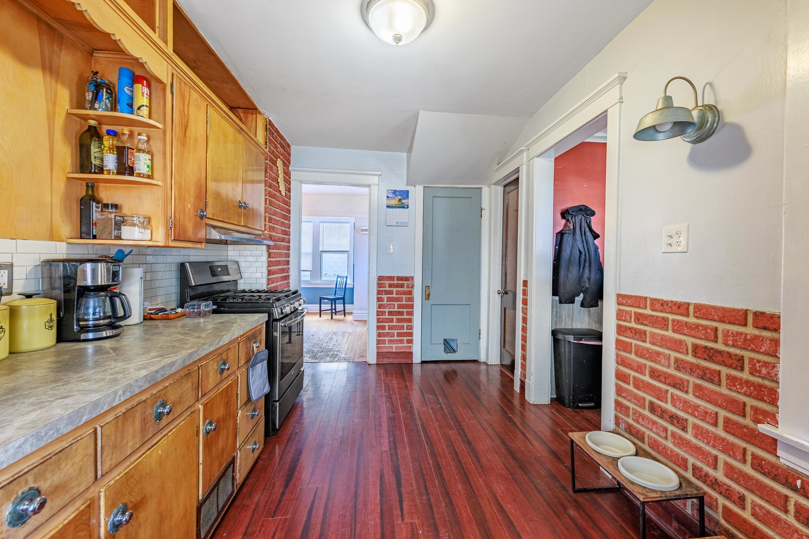 410 Repton Road Riverside, IL 60546 - Photo 10 of 30 a kitchen with stainless steel appliances granite countertop a stove and wooden floor