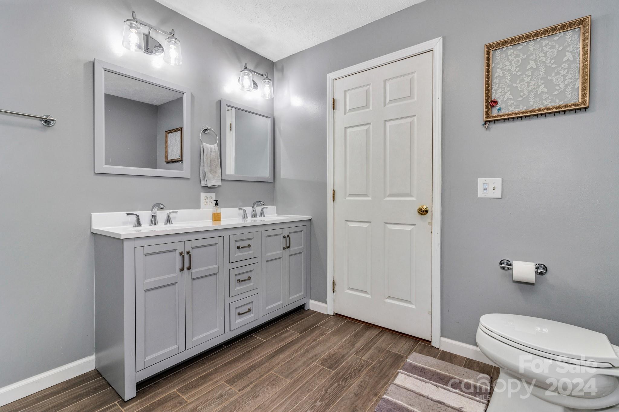368 Richards Ridge Canton, NC 28716 - Photo 20 of 34 a spacious bathroom with 2 sink toilet and a mirror
