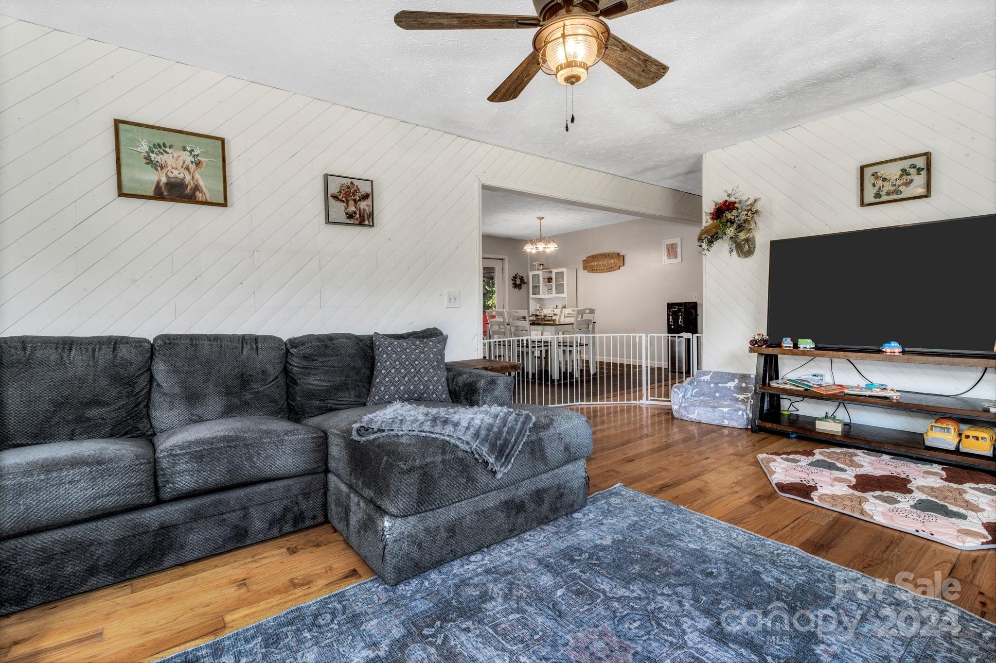 368 Richards Ridge Canton, NC 28716 - Photo 6 of 34 a living room with furniture and a flat screen tv