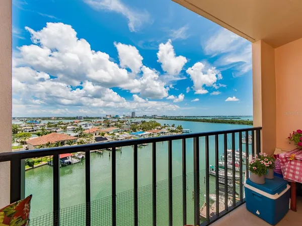 a view of a balcony with wooden floor