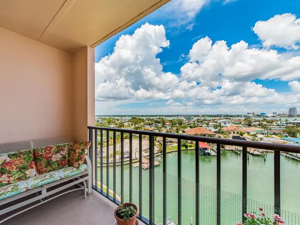 a view of a balcony with wooden fence