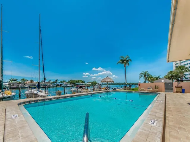 a view of a swimming pool with a patio