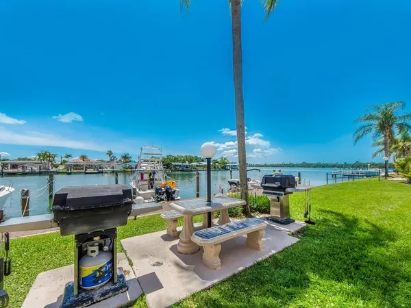 a view of a swimming pool with a table and chairs