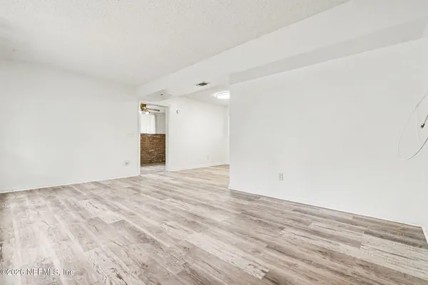 a living room with furniture potted plant and a window