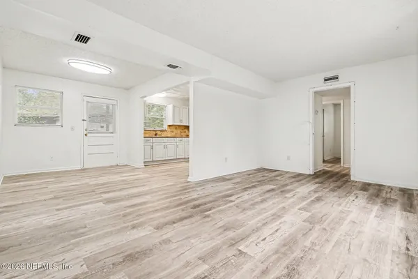 a view of an empty room with a window