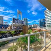 a view of a balcony with two chairs and a table