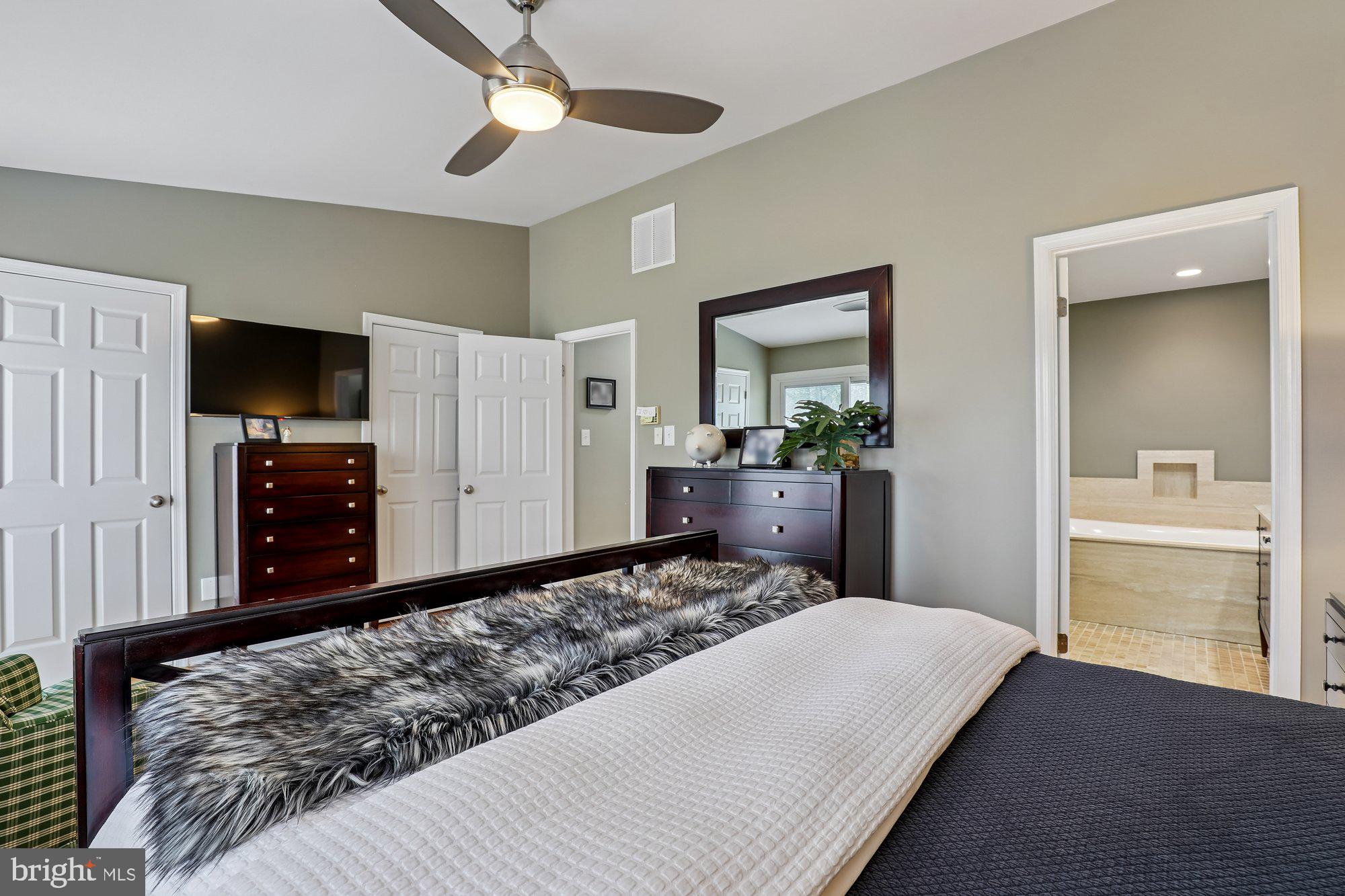 8019 Galla Knoll Circle Springfield, VA 22153 - Photo 28 of 57 a bedroom with a bed and a flat tv screen on dresser