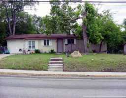 5409 Manor Road Austin, TX 78723 - Photo 1 of 1 a front view of a house with a garden and trees