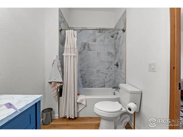 a bathroom with a toilet a sink and a bathtub